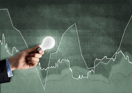 Conceptual image with light bulb diagrams and graphs