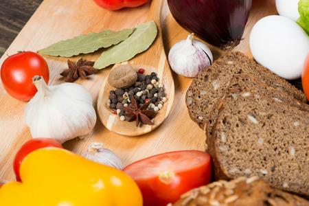 Set of vegetables and spices on kitchen tableの写真素材