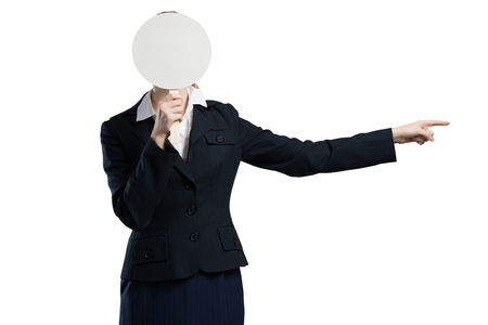 Businesswoman hiding her face behind round banner with smileyの写真素材