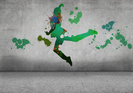 Image with color silhouette of dancer on gray wallの写真素材