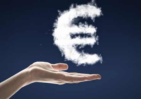 Conceptual image with cloud euro sign on palmの写真素材