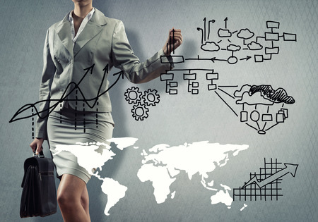 Close up of businesswoman sketching business projectの写真素材