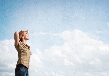 Pretty teenager girl in casual on cloud backgroundの写真素材
