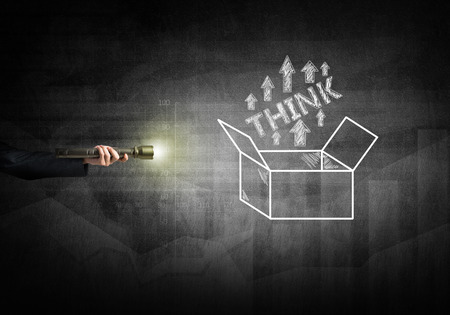 Close up of human hand with lantern and business concepts on wallの写真素材