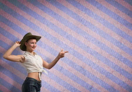 Female teenager girl on color stripped backgroundの写真素材