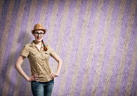 Pretty teenager girl in casual on color stripped backgroundの写真素材