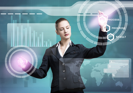 Pretty businesswoman working with virtual panel interface