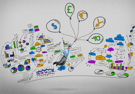 Young successful businessman flying on bunch of drawn balloons and infographs on backgroundの写真素材