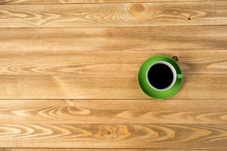 Top view cup of coffee on wooden table
