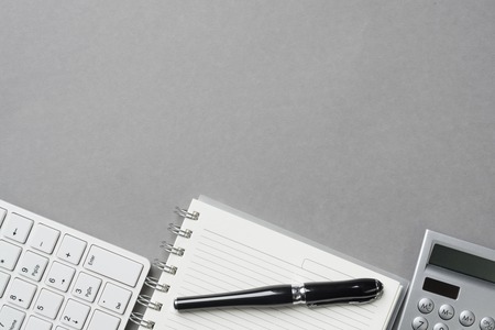 Concept of business still life with office objects on gray surfaceの写真素材
