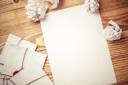 Top view of creative writing concept with papers on wooden tableの写真素材