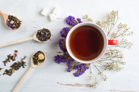 Herbal tea herbs and cookies on tableの写真素材