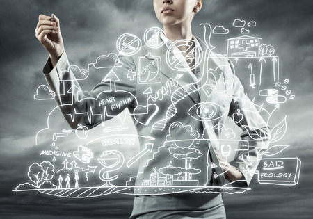 Close view of businesswoman drawing ecology concept on screenの写真素材