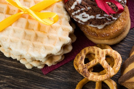 Cookies and biscuits for celebration on wooden tableの写真素材