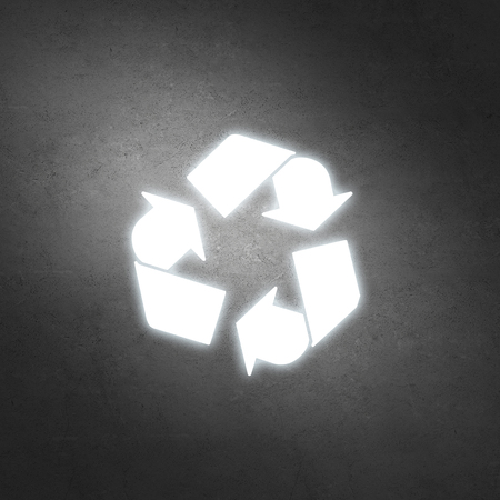 Ecology concept with recycling sign on concrete wall