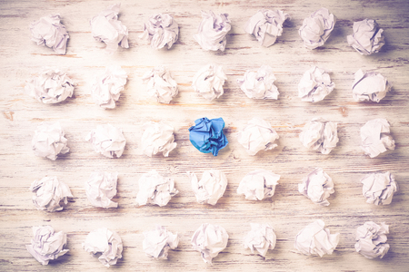 Set of crumpled paper balls with one colorfulの写真素材