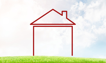 House figure as real estate symbol on clouds backgroundの写真素材