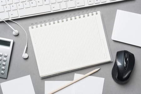 Concept of business still life with office objects on gray surfaceの写真素材