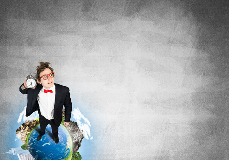 Funny disheveled businessman with alarm clock from top view. Elements of this image are furnished by NASAの写真素材