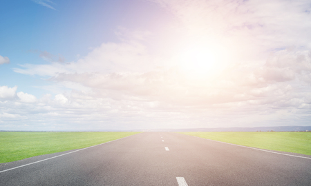 Natural summer landscape with asphalt road to horizonの写真素材