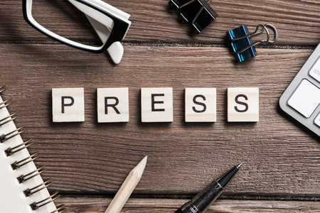 Workspace desk with keyboard office working stuff and wooden elements with the letters collected in the wordの写真素材