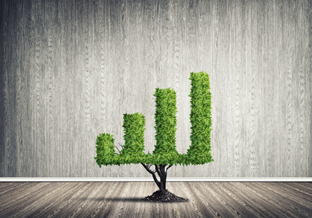 Market growth and success as growing green tree in shape of graphの写真素材