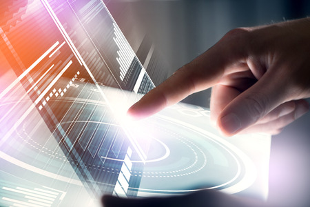 Businessman hand touching with finger virtual panel with infographs