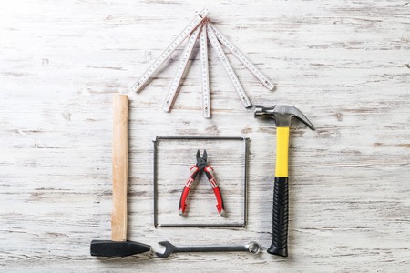 Variety of repair tools on wooden surfaceの写真素材