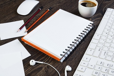 Business items notepad and stationary on wooden tableの写真素材