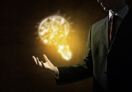 Close of businessman showing sketched idea in palmの写真素材