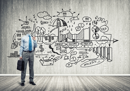 Headless engineer man with papers in hand against sketched backgroundの写真素材