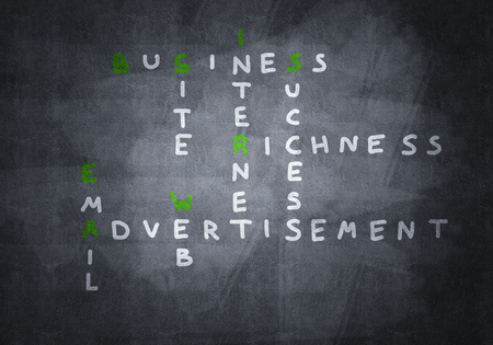 Studying concept with crossword drawn on blackboardの写真素材