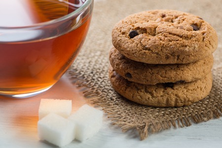 Herbal tea herbs and cookies on tableの写真素材