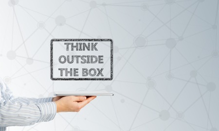 Hand of businessman holding tablet pc with creativity conceptの写真素材