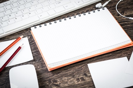 Business items notepad and stationary on wooden tableの写真素材