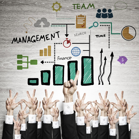Group of hands of businesspeople showing gestures on wooden backgroundの写真素材