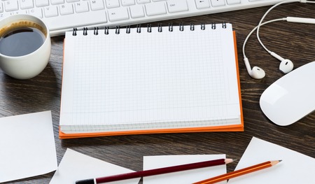 Business items notepad and stationary on wooden tableの写真素材