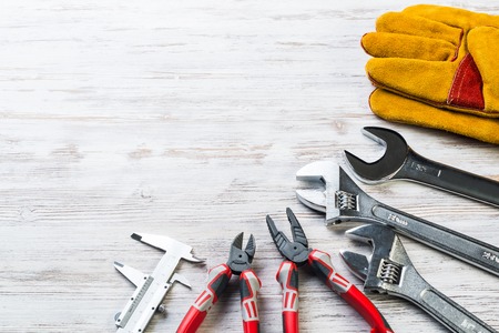 Variety of repair tools on wooden surfaceの写真素材