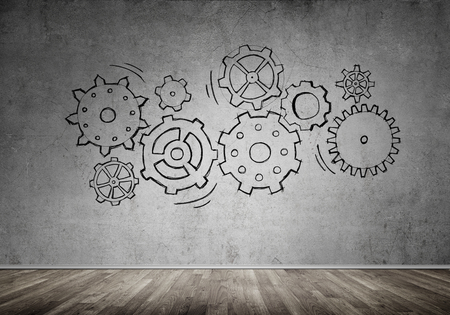 Gear hand drawn mechanism on gray wallの写真素材