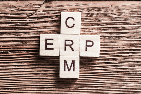 Words of business marketing collected in crossword with wooden cubesの写真素材