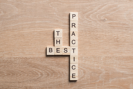 Words of business marketing collected in crossword with wooden cubesの写真素材