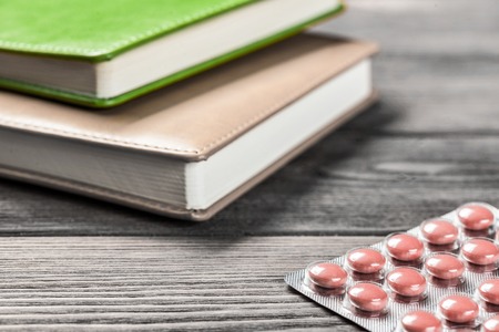 Pills on grunge wooden table. Medicine and drugstore conceptの写真素材