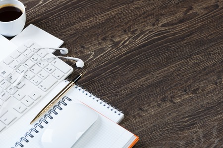 Business items notepad and stationary on wooden tableの写真素材