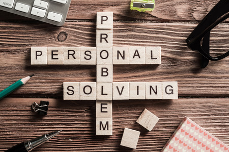 Words of personal solving problem collected in crossword with wooden cubes