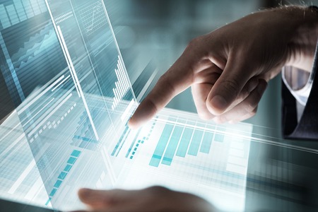 Businessman hand touching with finger virtual panel with infographs