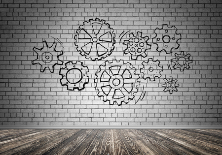 Gear hand drawn mechanism on gray wallの写真素材