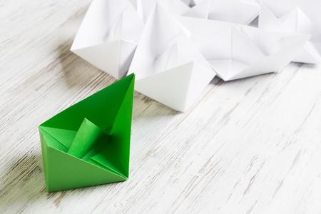 Set of origami boats on wooden tableの写真素材