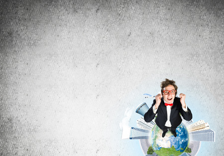 Businessman on Earth globeの写真素材