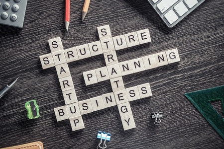 Conceptual business keywords on table with elements of game makiの写真素材