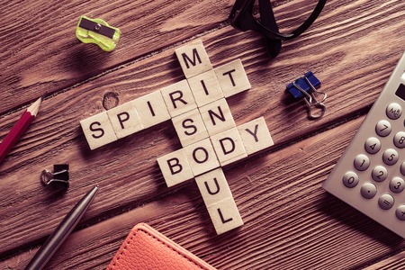 Conceptual keywords on wooden table with elements of game makingの写真素材